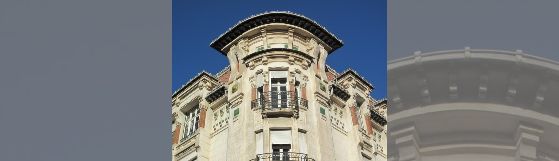 Angle du dernier niveau : nombreuses corniches , petits toits en avancée, décor de façade à base de pyramides en céramique verte